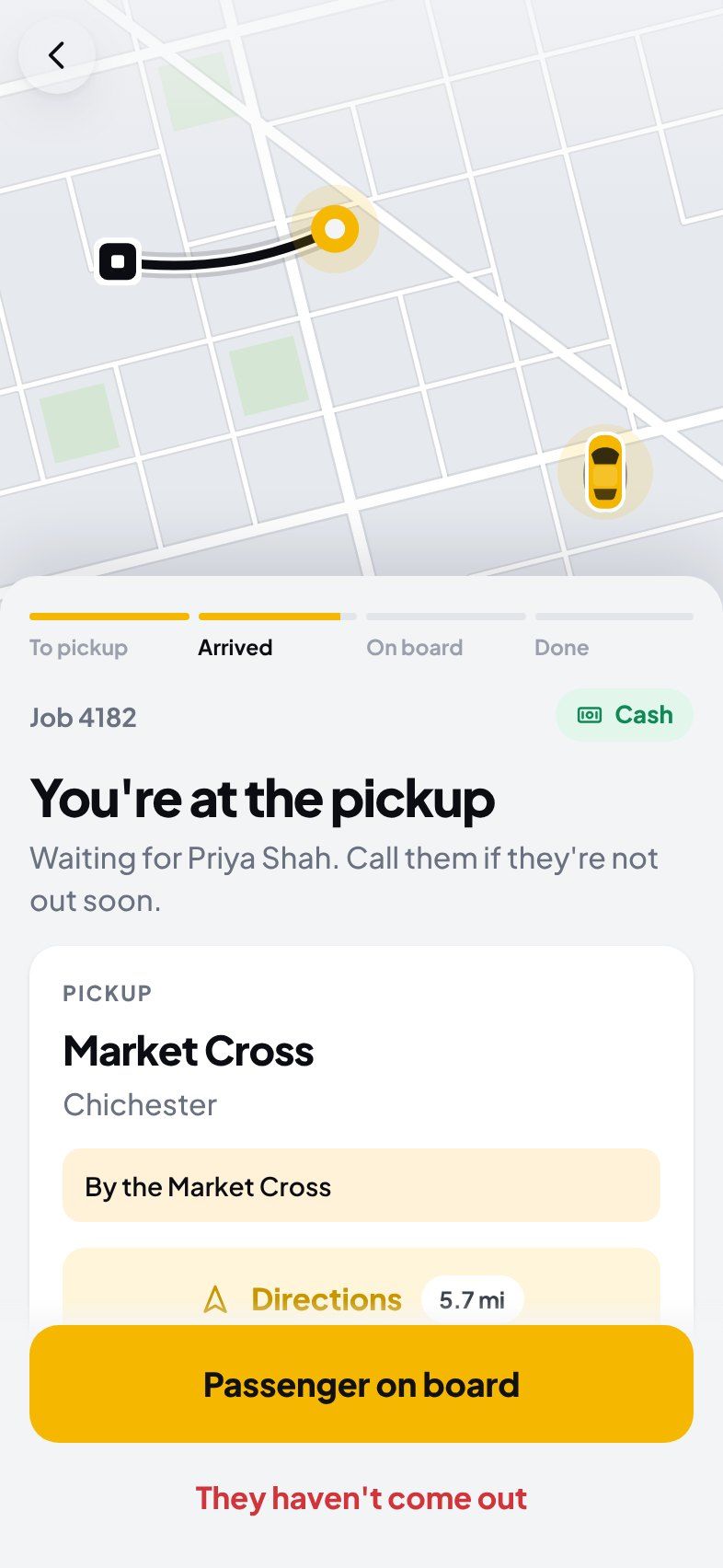 At the pickup, waiting for the passenger, with a “Passenger on board” button.