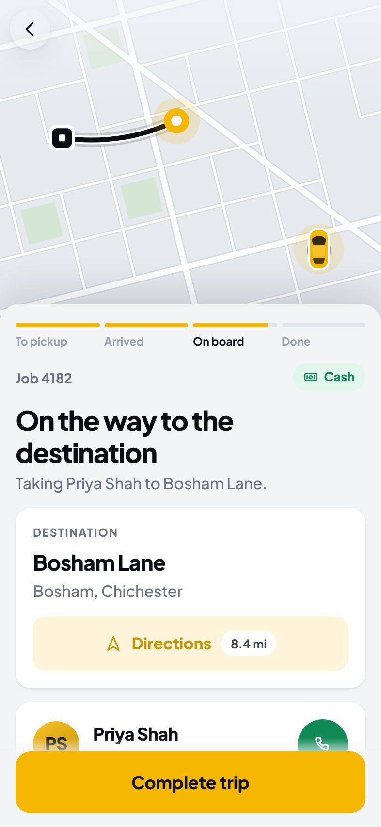 On the way to the destination with the passenger, with directions and a “Complete trip” button.